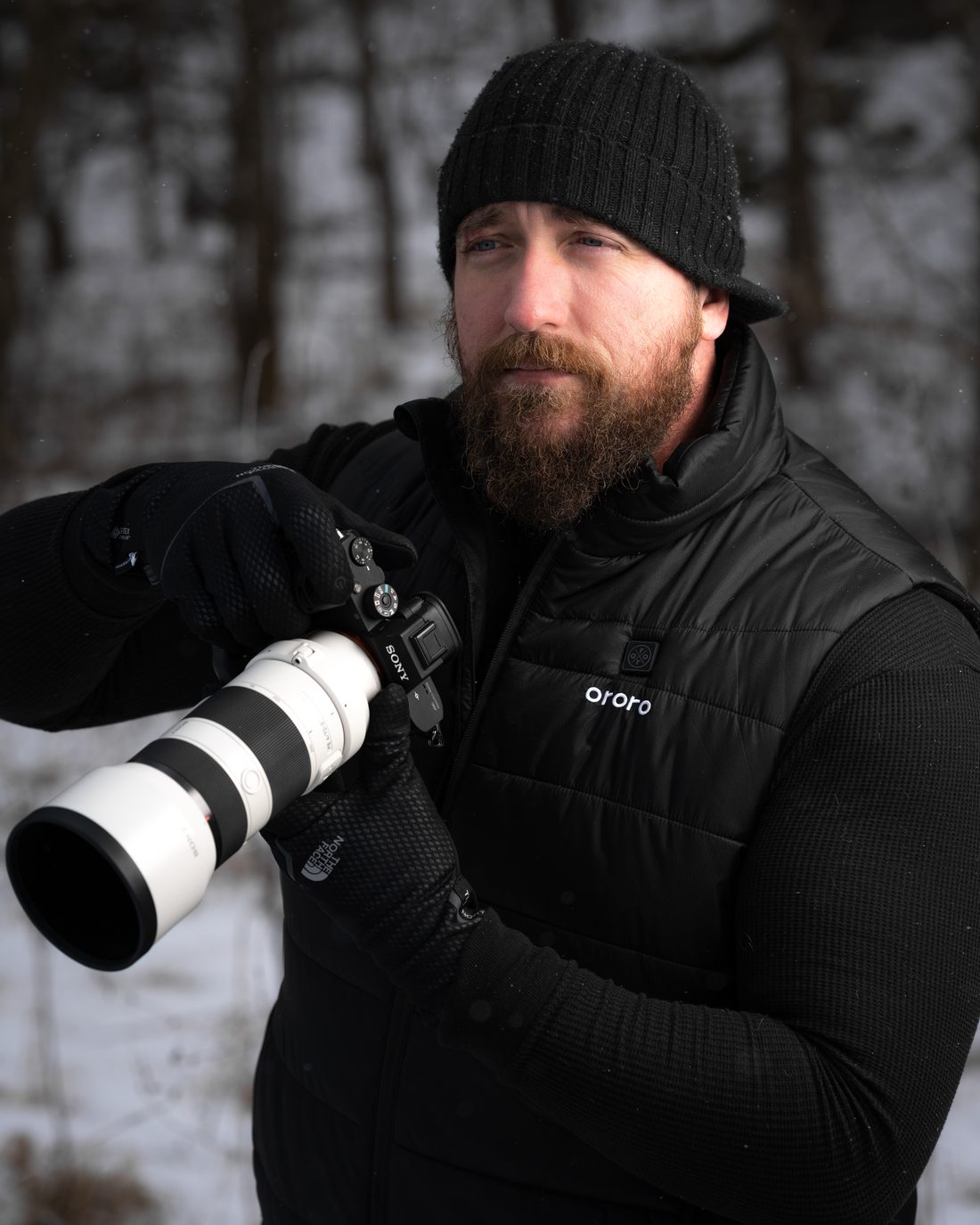 Jeff Jenkins, photographer, on a winter shoot with his Sony camera and telephoto lens